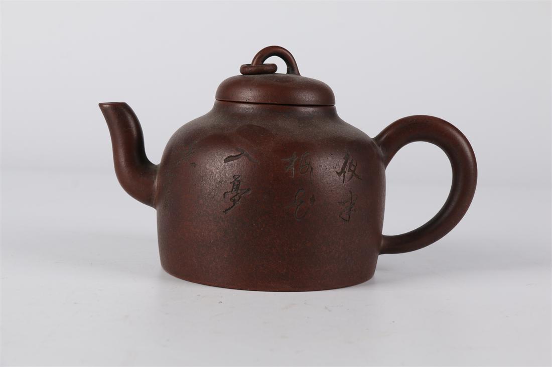 A PURPLE CLAY TEAPOT WITH CARVED POEM DESIGN. (1 of 7)