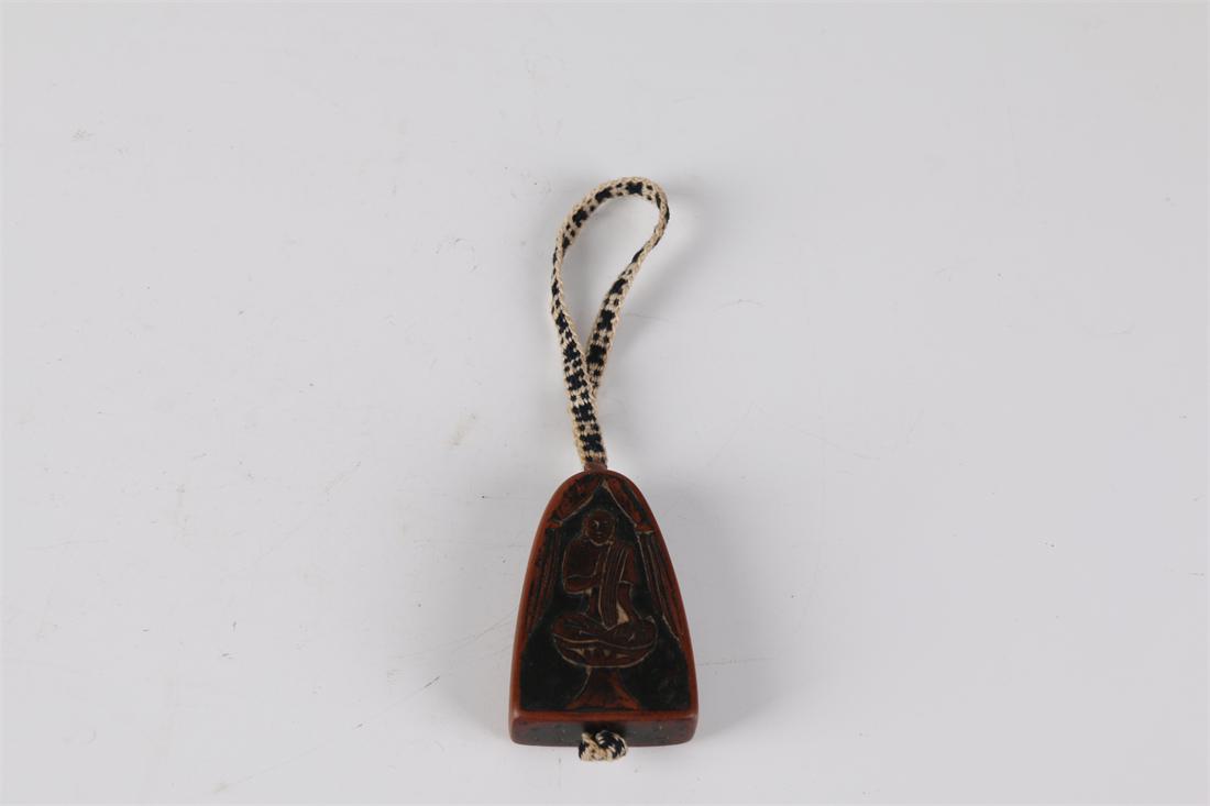 A TAOIST LIGHTING WOOD PENDANT. (1 of 7)