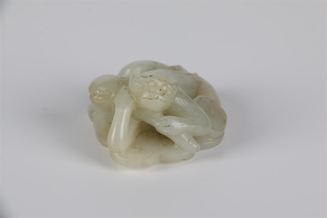 A HETIAN JADE MONKEY CARVING ORNAMENT. (1 of 7)