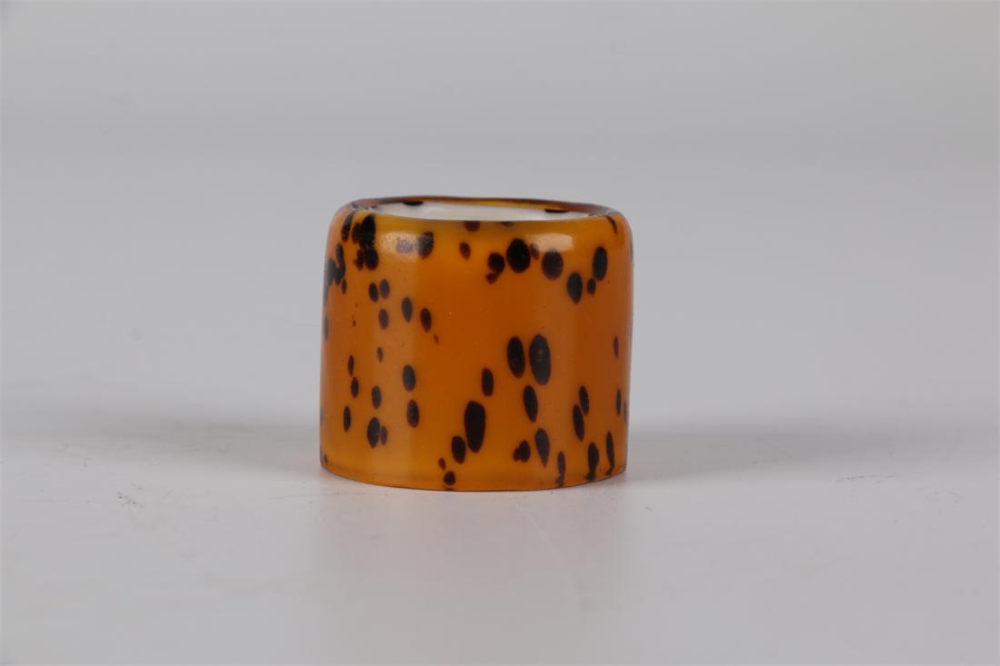 A GLASS THUMB RING. (1 of 8)