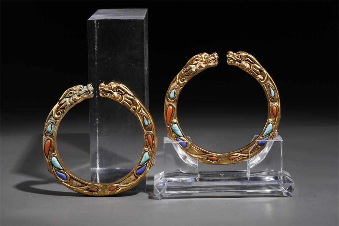 A PAIR OF GILT COPPER BANGLES. (1 of 6)