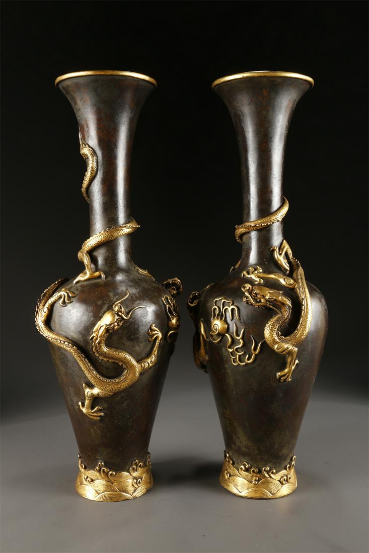 A PAIR OF COPPER BOTTLES, PARTLY GILT. (1 of 9)