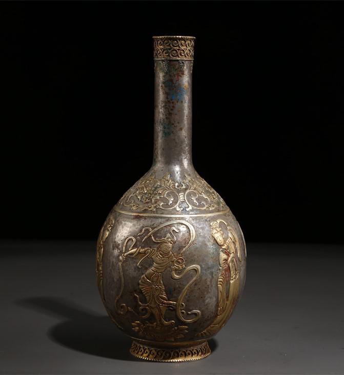 A LONG-NECK SILVER BOTTLE WITH LADIES MOTIF. (1 of 9)