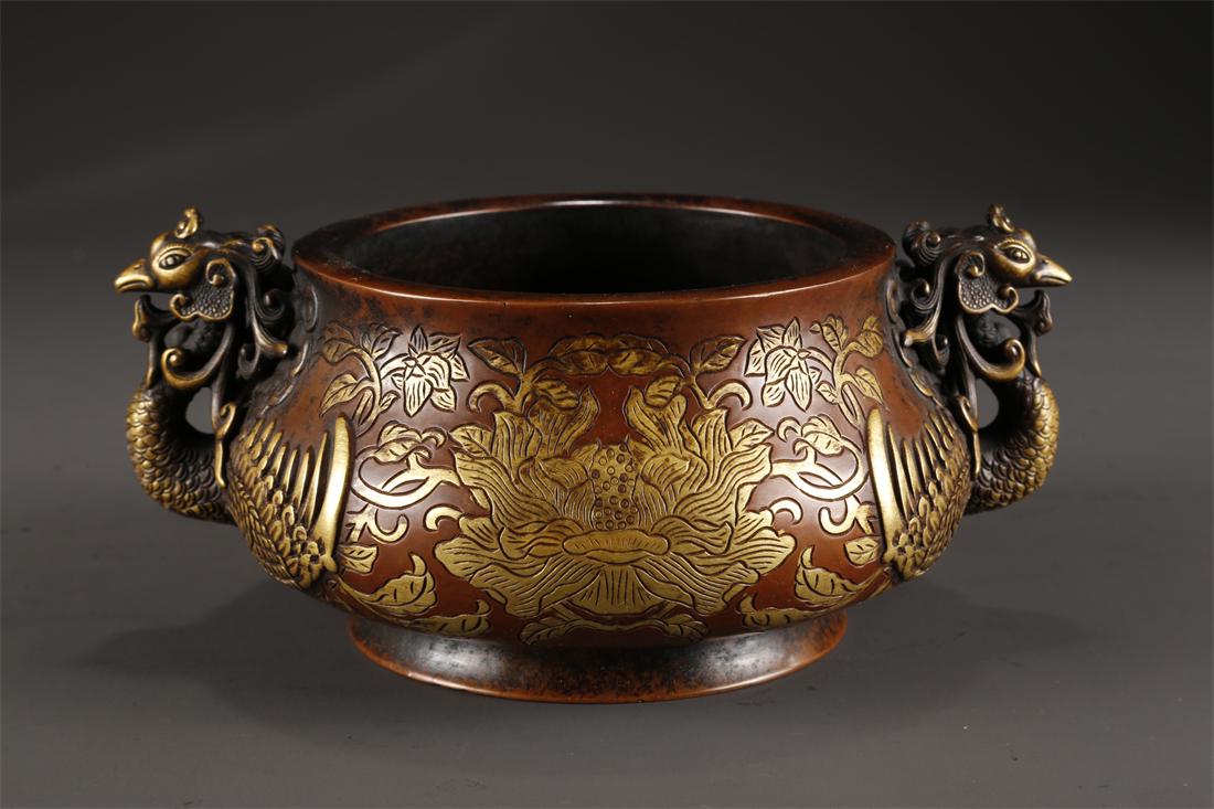 A COPPER CENSER WITH PHOENIX-SHAPED EARS. (1 of 9)