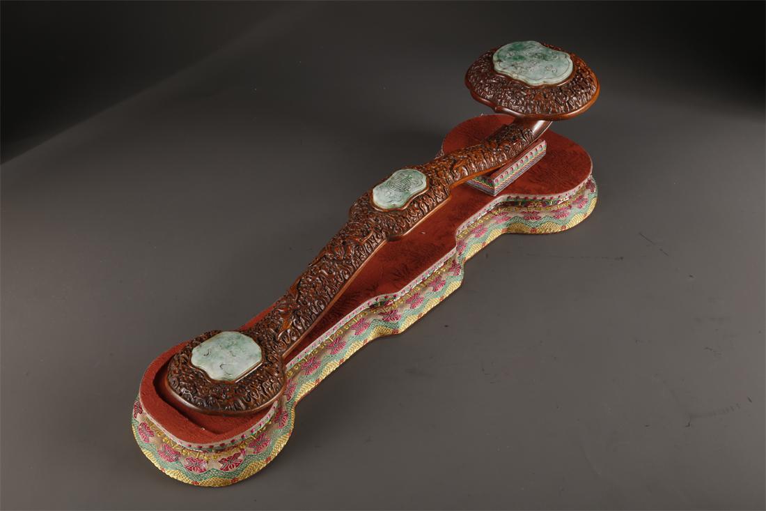 A HUANGHUALI WOOD RUYI SCULPTURE. (1 of 9)