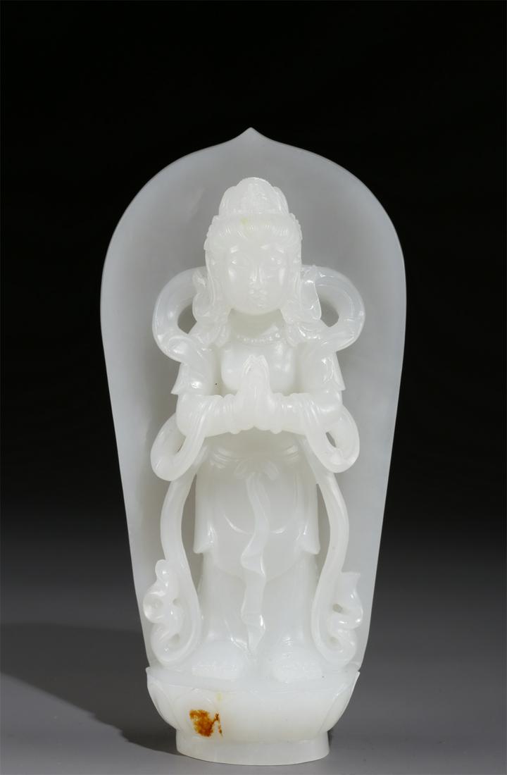 A HETIAN WHITE JADE AVALOKITESVARA STATUE. (1 of 9)