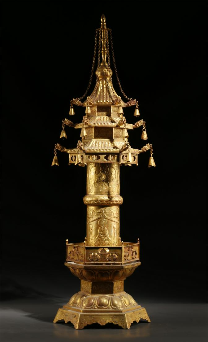 A GILT COPPER BUDDHIST STUPA. (1 of 9)