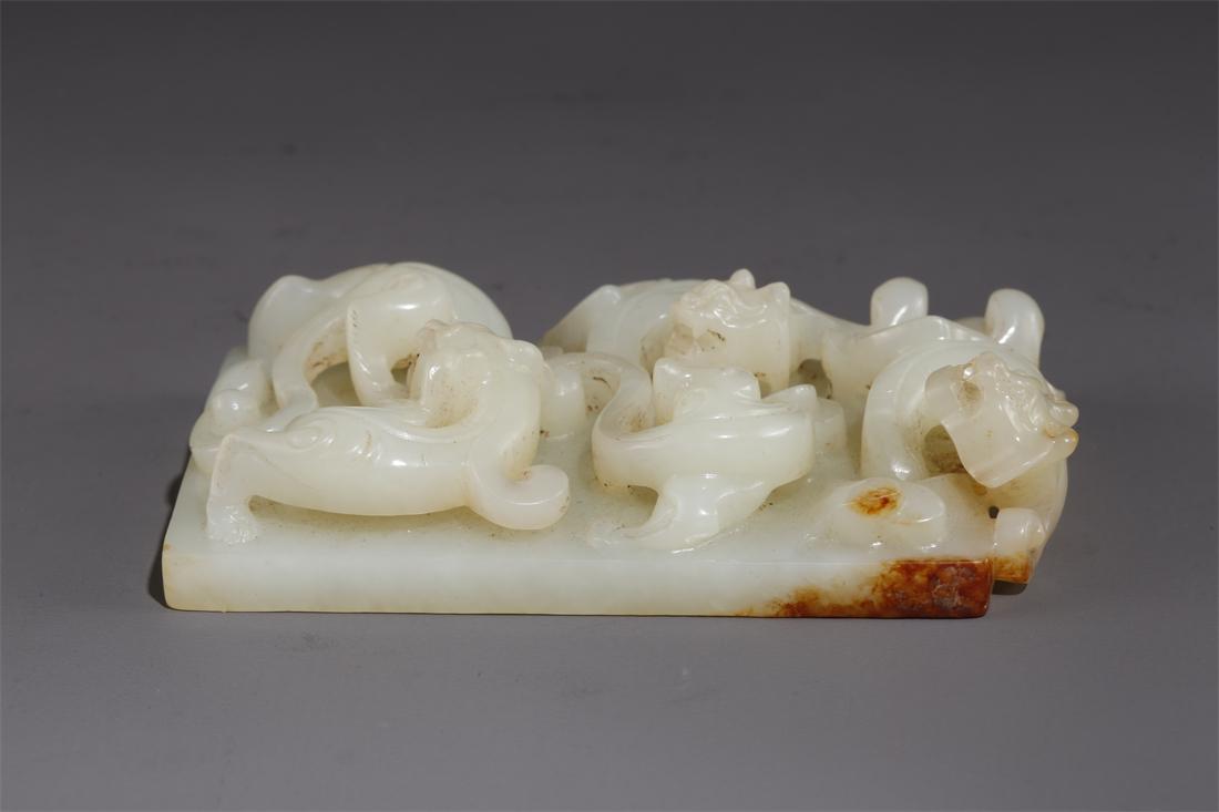 A HETIAN JADE BRUSH RACK WITH TIGERS DESIGN. (1 of 6)