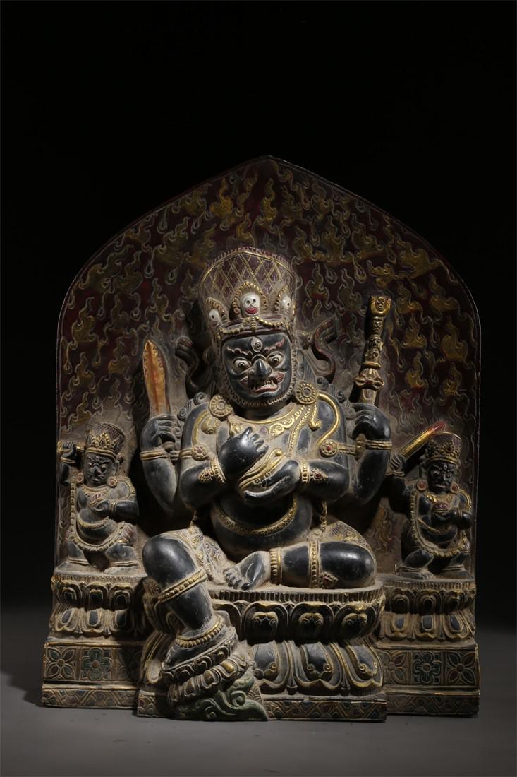 A BLACK STONE FOUR-ARM MAHAKALA BUDDHA STATUE. (1 of 9)