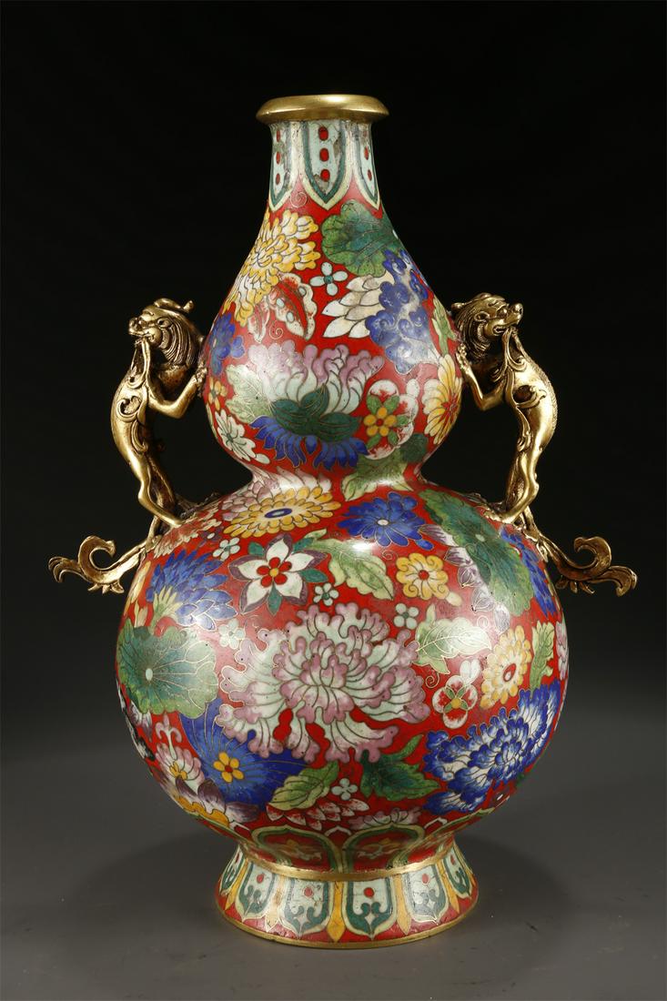 A CLOISONNE ENAMELED COPPER BOTTLE. (1 of 9)