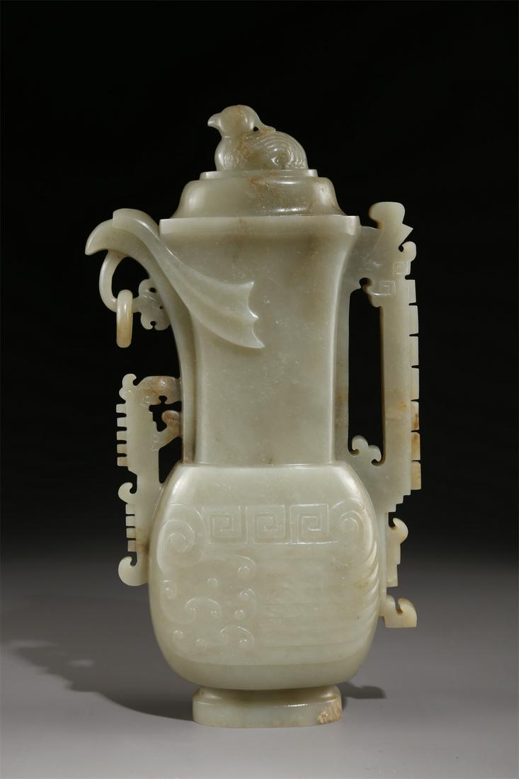 A HETIAN JADE HANDLED POT. (1 of 9)