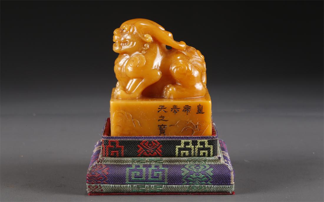 A FIELD-YELLOW STONE BEAST-KNOB SEAL. (1 of 9)