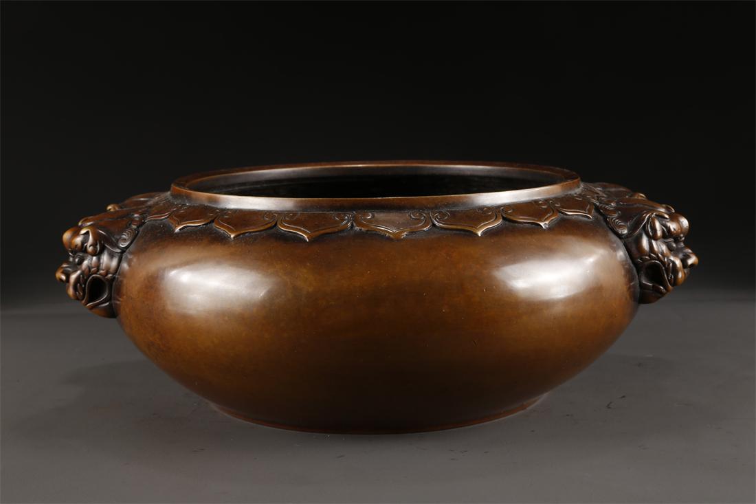 A COPPER CENSER WITH LION-SHAPED EARS. (1 of 7)