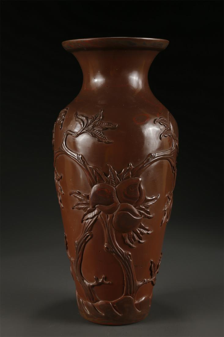 A GLASS BOTTLE WITH BATS AND PEACHES DESIGN. (1 of 9)