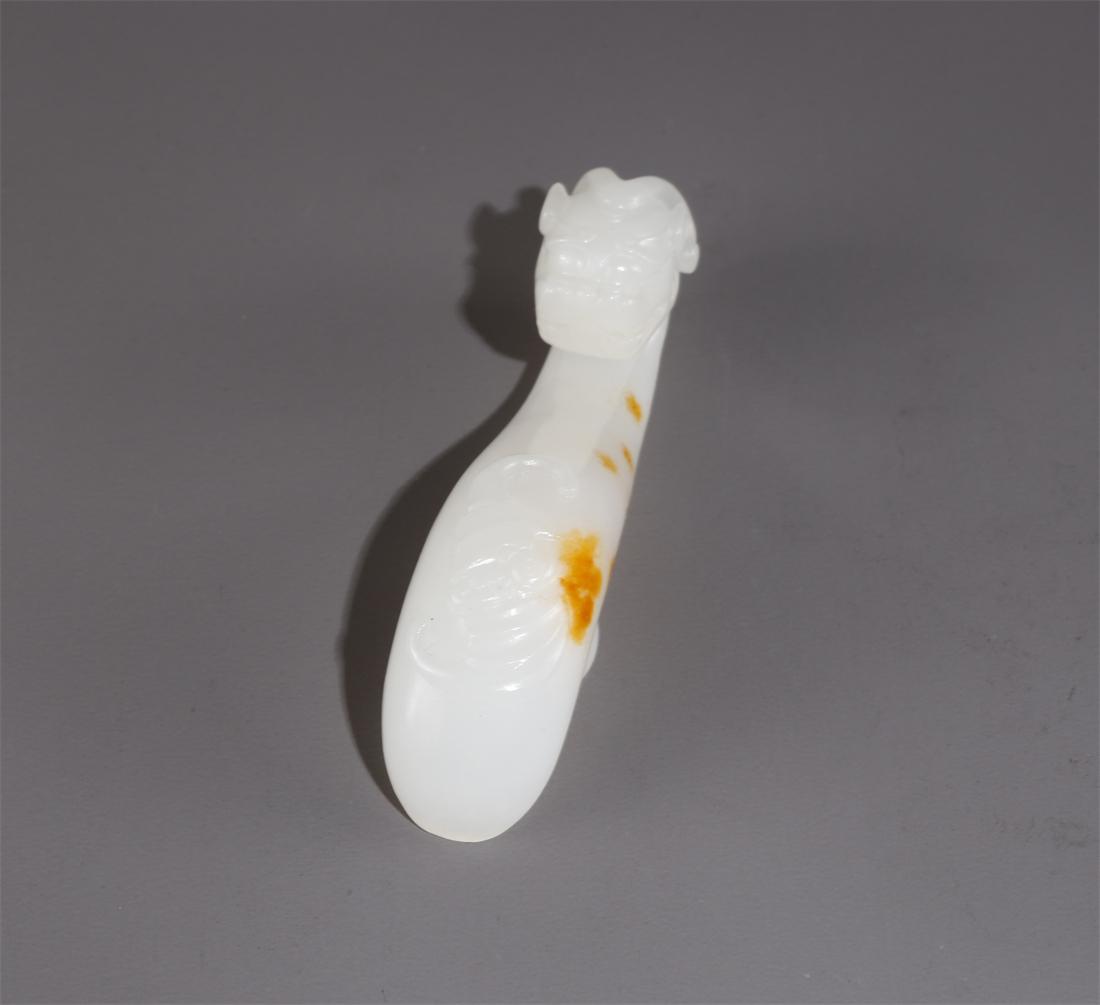 A HETIAN JADE BELT BUCKLE WITH DRAGON DESIGN. (1 of 7)