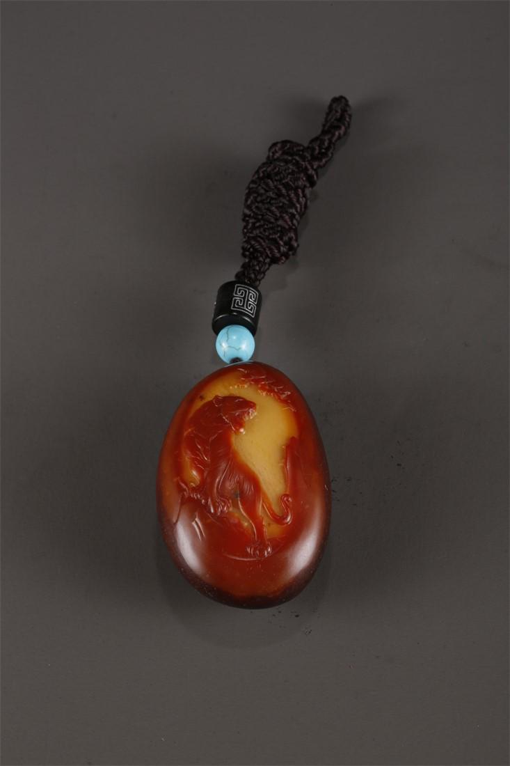 A HETIAN RAW JADE PENDANT. (1 of 6)