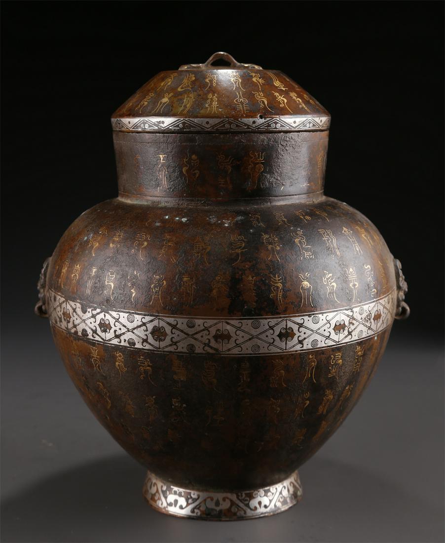 A BRONZE LIDDED JAR WITH GOLD AND SILVER INLAY. (1 of 9)
