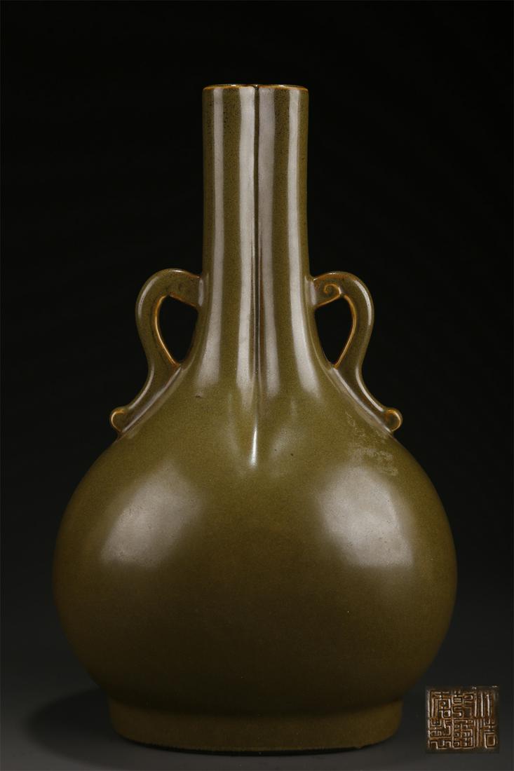 A GLAZED DOUBLE-SPOUT PORCELAIN BOTTLE. (1 of 8)