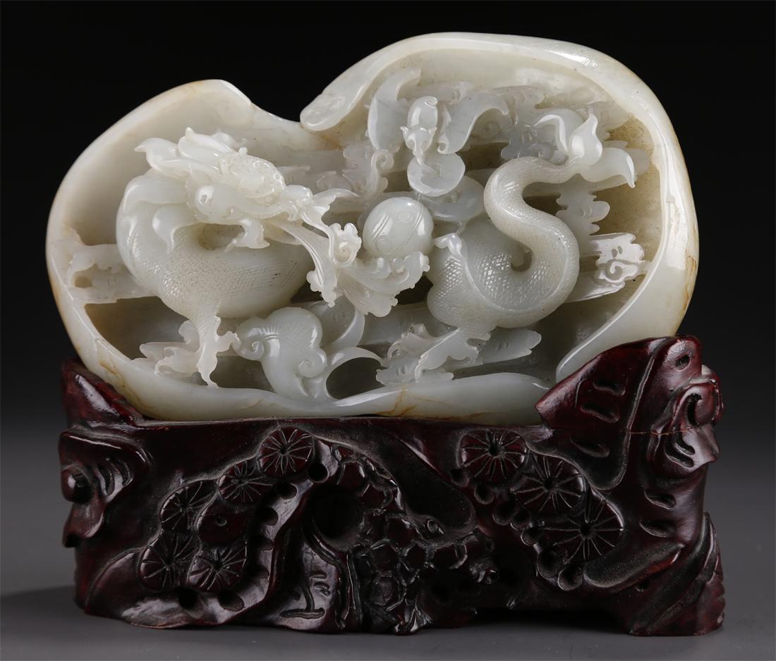 A HETIAN RAW JADE ROCKERY WITH DRAGON DESIGN. (1 of 10)