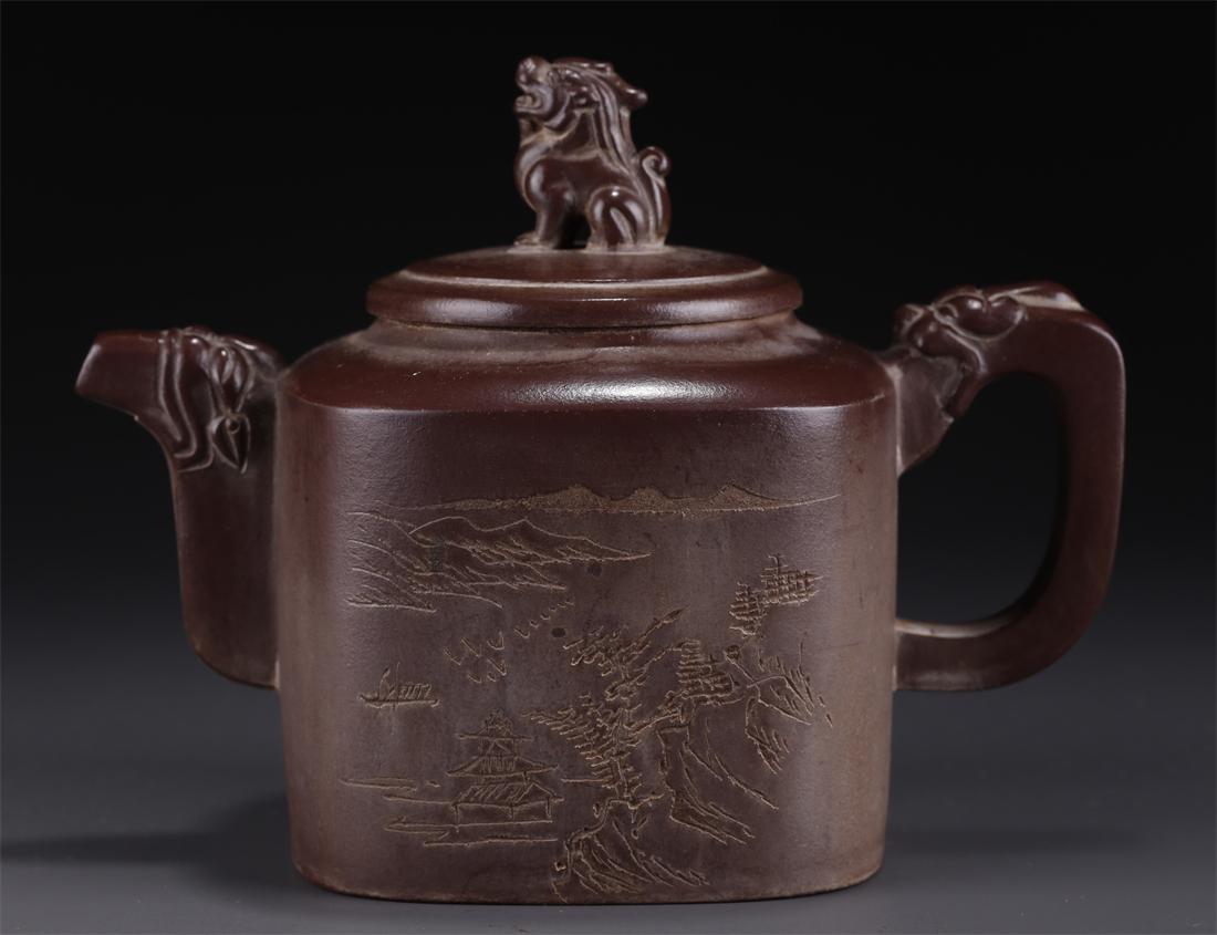 A PURPLE CLAY TEAPOT WITH LANDSCAPE DESIGN. (1 of 10)