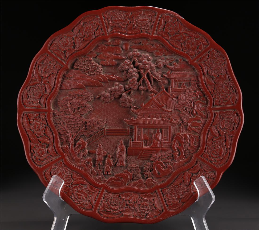 A RED LACQUER PLATE WITH LANDSCAPE DESIGN. (1 of 9)