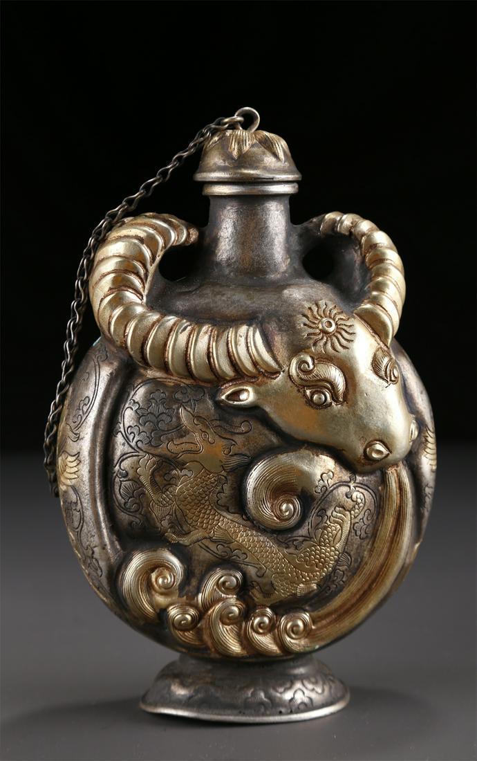 A BRONZE POT WITH BULL HORN DESIGN. (1 of 9)