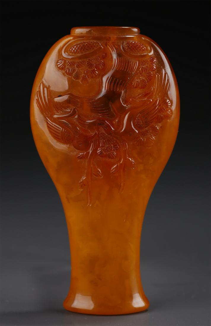 A WALL-HANGING AMBER BOTTLE. (1 of 9)