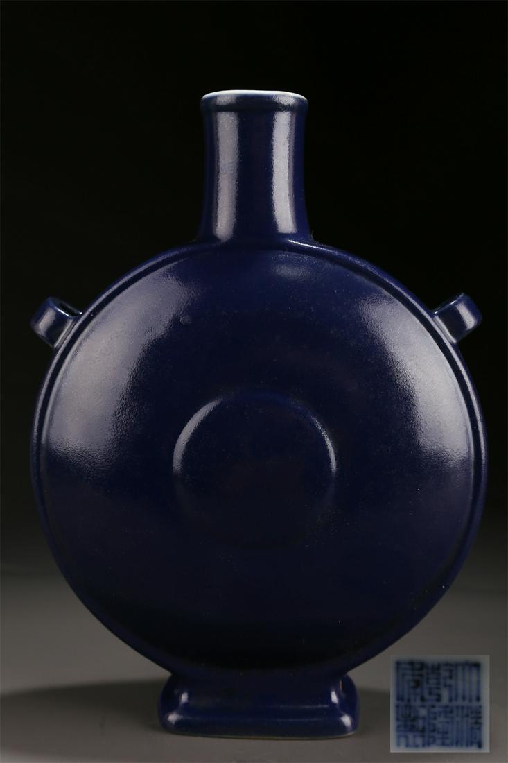 A SHINY BLUE GLAZED PORCELAIN BOTTLE. (1 of 8)