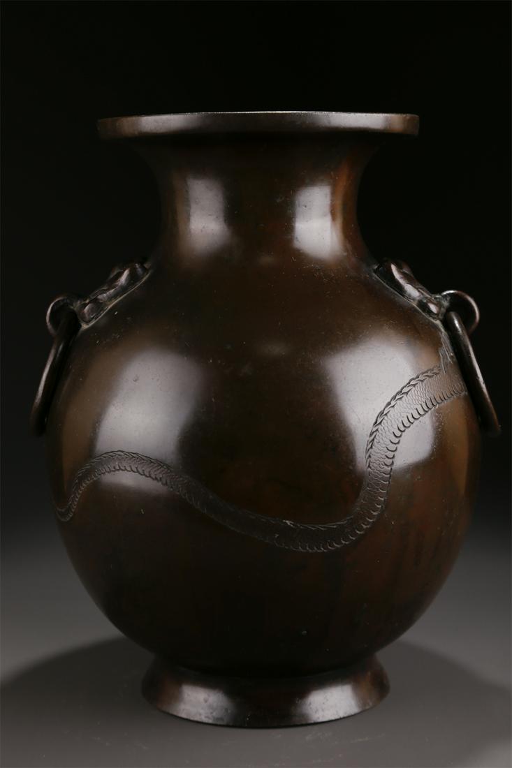 A BRONZE BOTTLE WITH DRAGON DESIGN. (1 of 9)