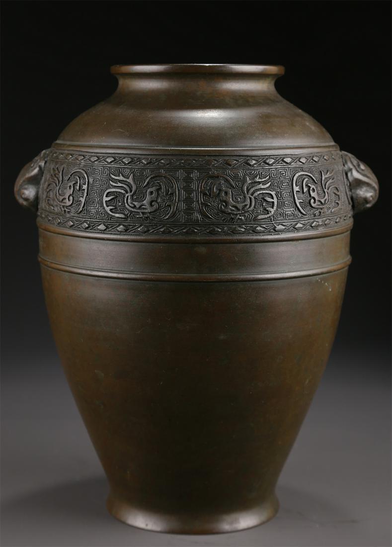 A BRONZE JAR WITH BEAST-SHAPED EARS. (1 of 8)