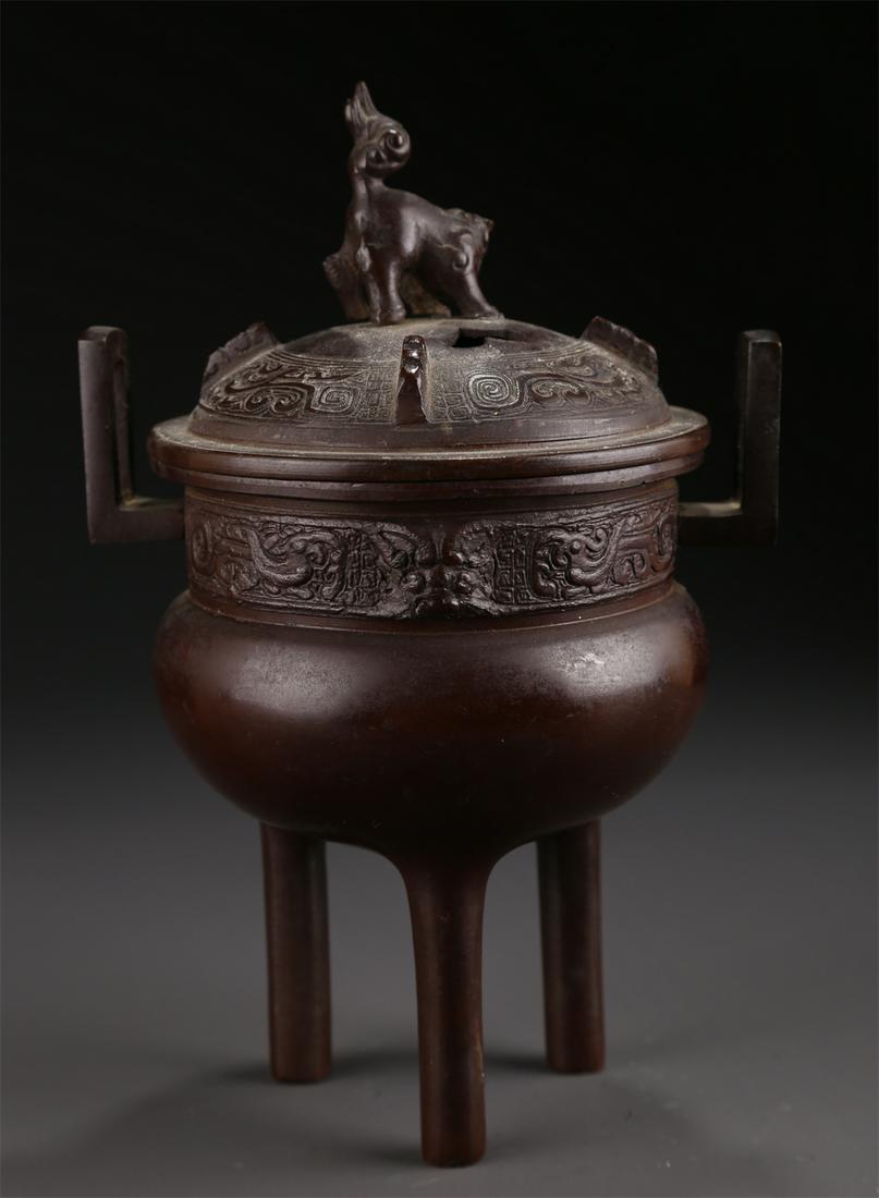 A THREE-LEG LION-KNOB BRONZE INCENSE BURNER. (1 of 10)