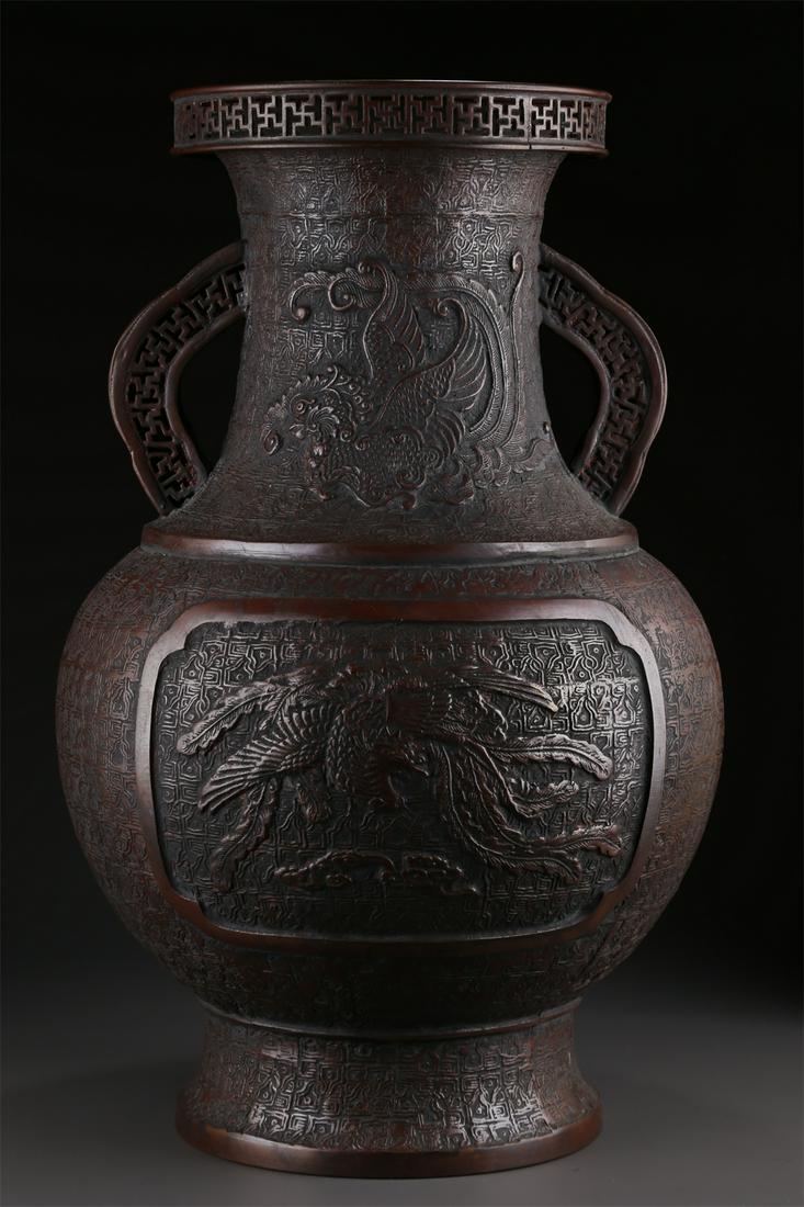 A TWO-EAR BRONZE BOTTLE WITH PHOENIX DESIGN. (1 of 9)