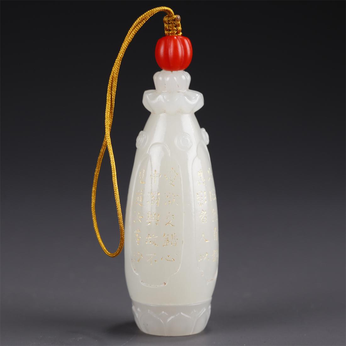 A HETIAN JADE PENDANT WITH BUDDHA DESIGN. (1 of 12)