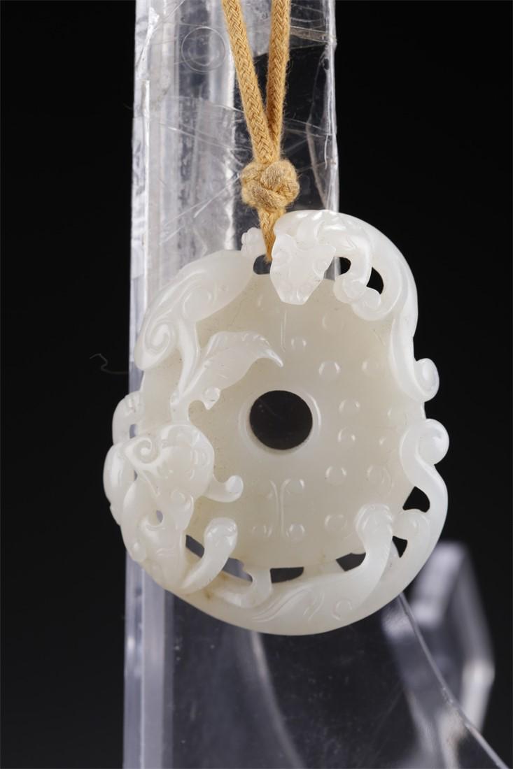 A HETIAN JADE PLATE "BI" WITH DRAGON DESIGN. (1 of 8)