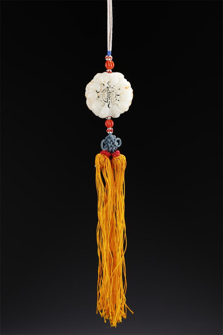 A HETIAN JADE SACHET WITH BATS DESIGN. (1 of 6)