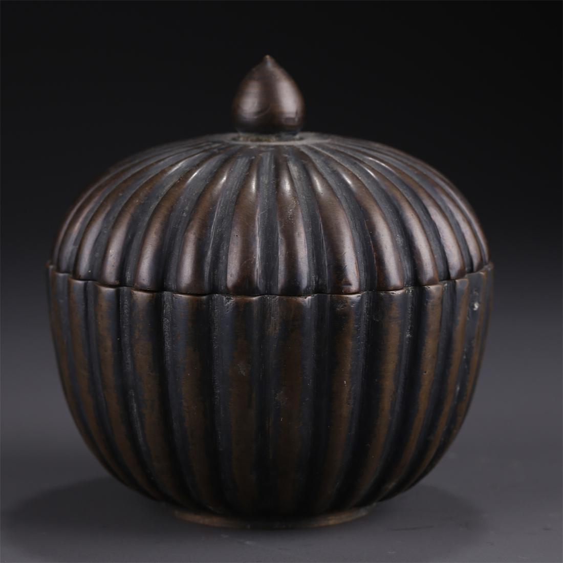 A RIDGED-MELON-SHAPED BRONZE BOX WITH LID. (1 of 8)