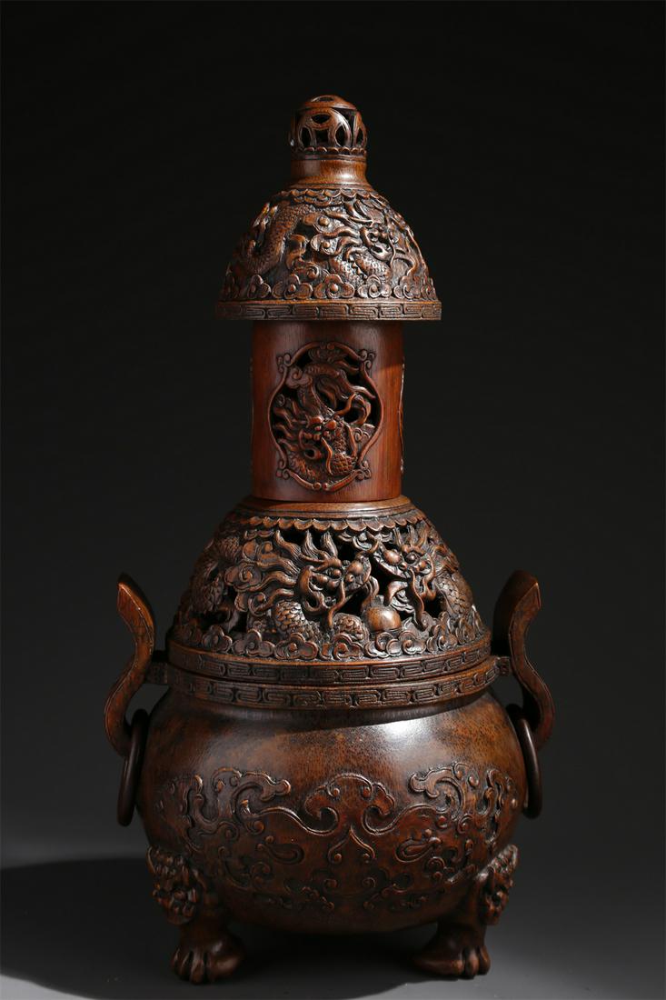 A BAMBOO INCENSE BURNER WITH DRAGON DESIGN. (1 of 10)