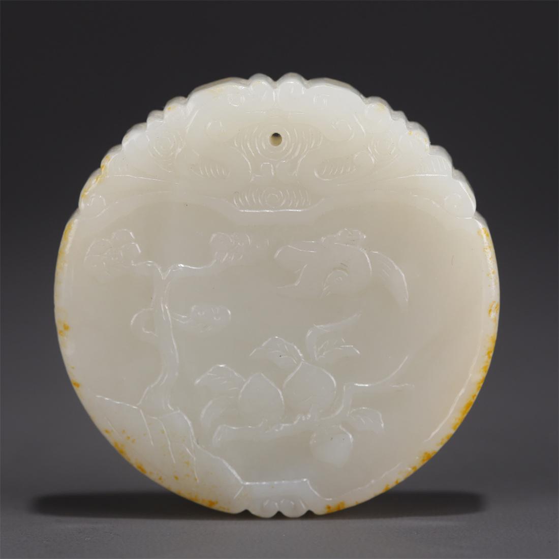 A HETIAN JADE PENDANT WITH FLOWERS DESIGN. (1 of 8)