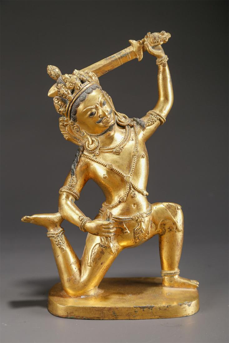 A GILT BRONZE ACALANATHA BUDDHA STATUE. (1 of 9)