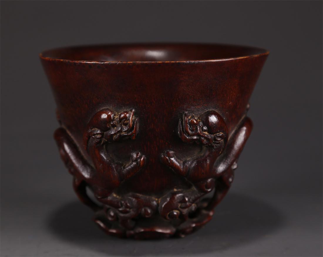 A BAMBOO CUP WITH CARVED DRAGON DESIGN. (1 of 9)