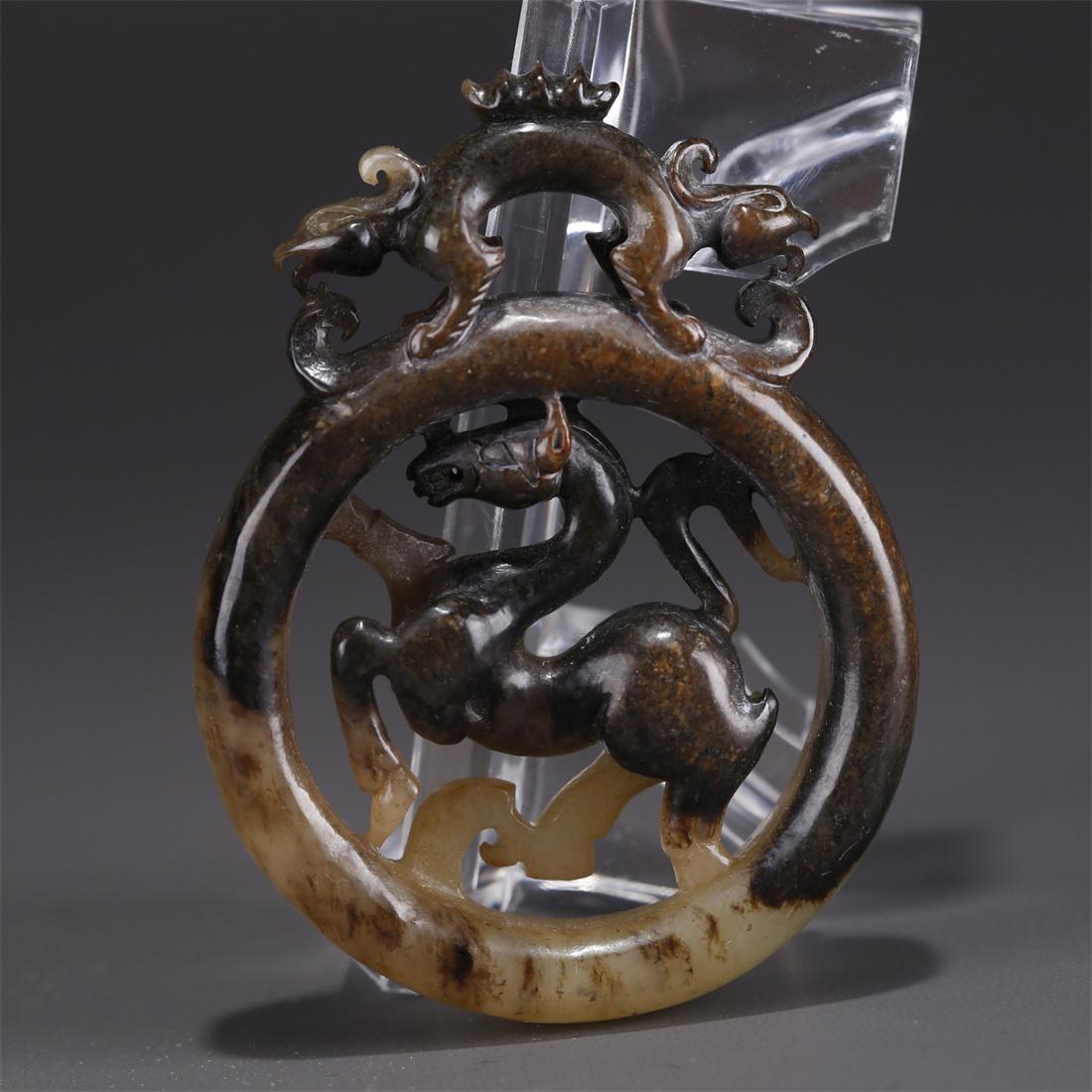 A HETIAN JADE GALLOPING STEED CARVING PENDANT. (1 of 9)