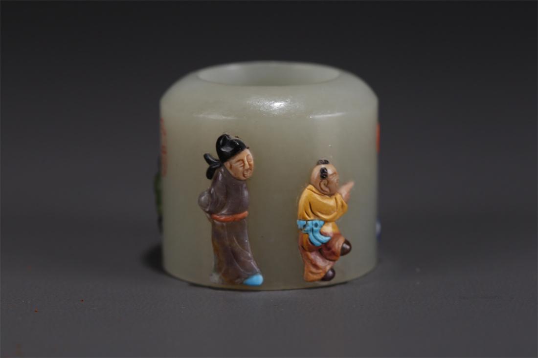 A HETIAN JADE THUMB RING, INLAID WITH JEWELS. (1 of 8)