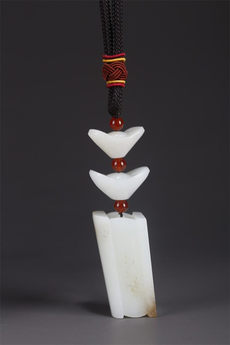 A HETIAN JADE COFFIN AND INGOT CARVING PENDANT. (1 of 11)
