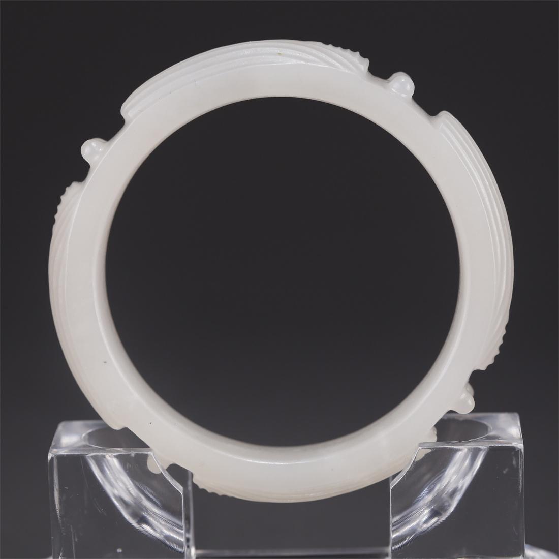 A HETIAN JADE BANGLE. (1 of 7)