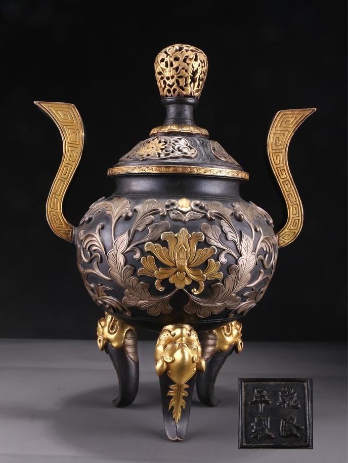 A BRONZE INCENSE BURNER WITH UPWARD EARS. (1 of 10)