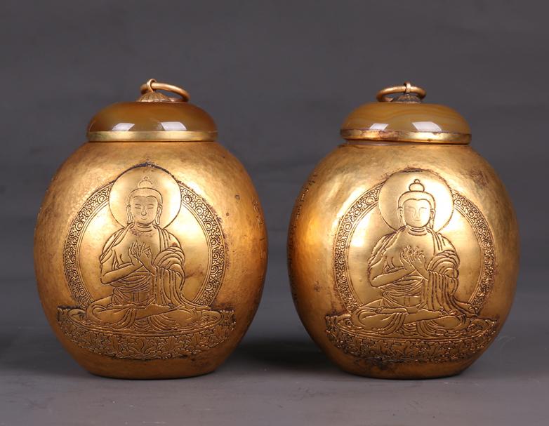 A PAIR OF GILT BRONZE LIDDED JARS. (1 of 7)