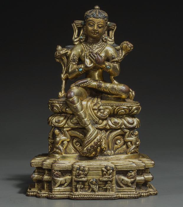 A GILT BRONZE MAITREYA BODHISATTVA STATUE. (1 of 11)
