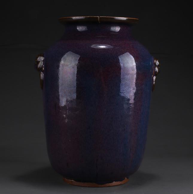 A PORCELAIN BOTTLE WITH BEAST FACE DESIGN. (1 of 6)