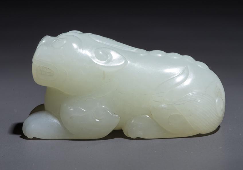 A HETIAN JADE AUSPICIOUS BEAST CARVING. (1 of 8)