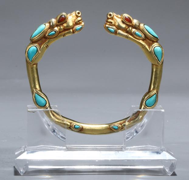 A GILT BRONZE BANGLE. (1 of 7)